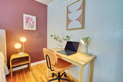 a room with a desk with a laptop on it at Joy House in Golden
