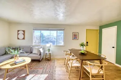 a living room with a couch and a table at Joy House in Golden