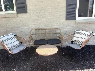 three wicker chairs and a table and a wall at Boho Cozy House with bikes, 2 blocks to Sloans Lake! in Denver