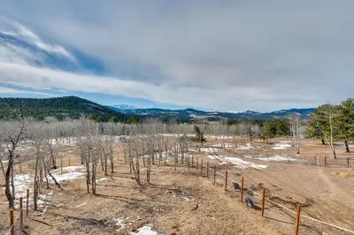 a field of trees with mountains in the background at 3 Mi to Casinos Cabin with Stables in Black Hawk! in Black Hawk