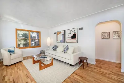 a living room with a white couch and a table at 5 minute drive to Pearl Street - Best Neighborhood in Boulder in Boulder