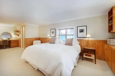 a bedroom with a large white bed and a window at 5 minute drive to Pearl Street - Best Neighborhood in Boulder in Boulder