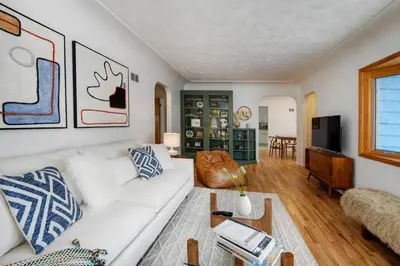 a living room with a white couch and a table at 5 minute drive to Pearl Street - Best Neighborhood in Boulder in Boulder