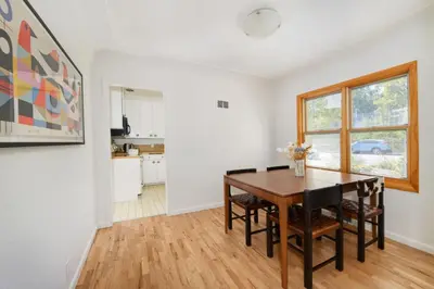 a dining room with a table and a kitchen at 5 minute drive to Pearl Street - Best Neighborhood in Boulder in Boulder