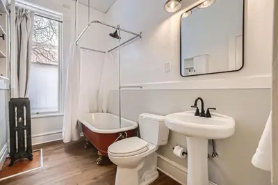 a bathroom with a toilet and a sink and a tub at Cloud by Modern Midstay - 1 Block to City Park #C1 in Denver