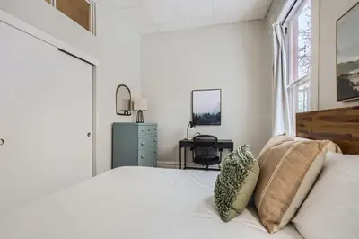 a white bedroom with a bed and a desk at Cloud by Modern Midstay - 1 Block to City Park #C1 in Denver