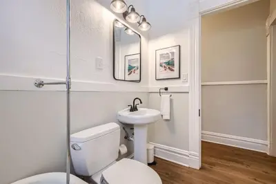 a bathroom with a toilet and a sink at Cloud by Modern Midstay - 1 Block to City Park #C1 in Denver