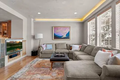 a living room with a couch and a table at 107 Red Quill in Winter Park