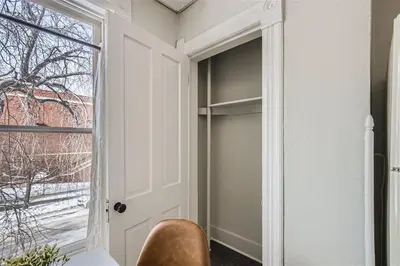 a room with a closet with a door and a window at Cloud by Modern Midstay - 1 Block to City Park #C5 in Denver