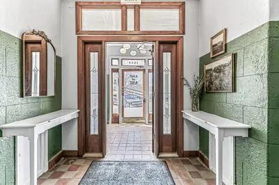 a door to a building with green and white walls at Detroit by Modern Midstay - On City Park #T22 in Denver
