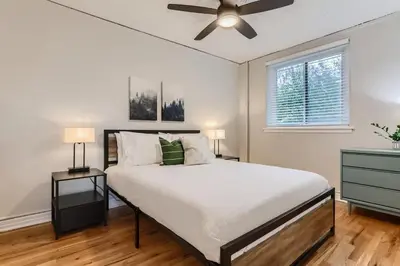 a bedroom with a bed and a ceiling fan at Detroit by Modern Midstay - On City Park #T22 in Denver