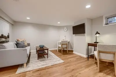 a living room with a couch and a table at York by Modern Midstay - 3 Blocks to Cheesman #NYB in Denver