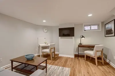 a living room with a table and a desk at York by Modern Midstay - 3 Blocks to Cheesman #NYB in Denver