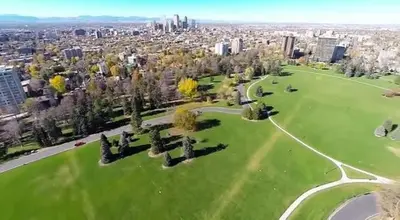 an aerial view of a park with a city in the background at York by Modern Midstay - 3 Blocks to Cheesman #NYB in Denver