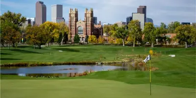 a golf course with a pond in front of a city at York by Modern Midstay - 3 Blocks to Cheesman #NYB in Denver