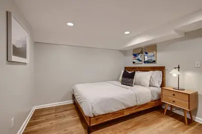 a white bedroom with a bed and a night stand at York by Modern Midstay - 3 Blocks to Cheesman #NYB in Denver