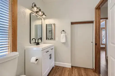 a bathroom with a sink and a mirror at 1st Ave by Modern Midstay - Wash Park & SoBo #F2 in Denver