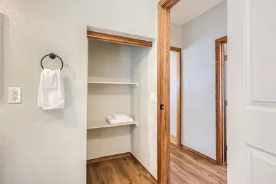 a bathroom with a towel hanging on a wall at 1st Ave by Modern Midstay - Wash Park & SoBo #F2 in Denver