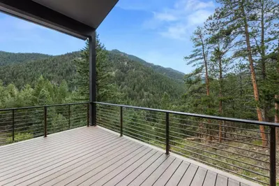 a balcony with a view of the mountains at Pineview Panorama Luxe Retreat 20 Mins to Boulder in Jamestown