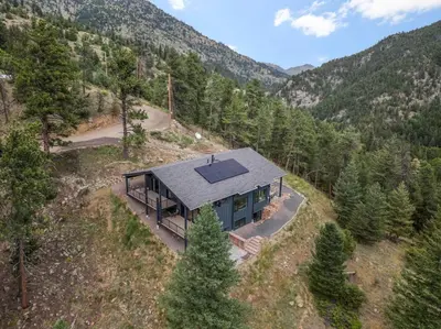 an aerial view of a house in the mountains at Pineview Panorama Luxe Retreat 20 Mins to Boulder in Jamestown