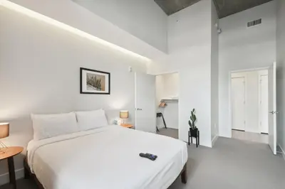 a white bedroom with a large white bed in it at Cloud Nine Retreat at Espadin in Denver