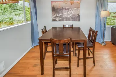 a dining room with a table and chairs at Super Cute Five Bedroom Home in Denver Perfect For Girls Trips in Denver