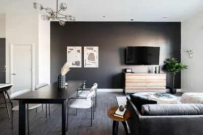 a living room with a table and a couch at Relaxed Elegance at Espadin in Denver