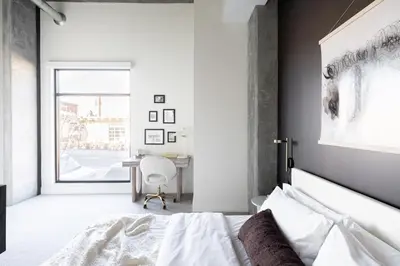 a white bedroom with a bed and a desk at Relaxed Elegance at Espadin in Denver