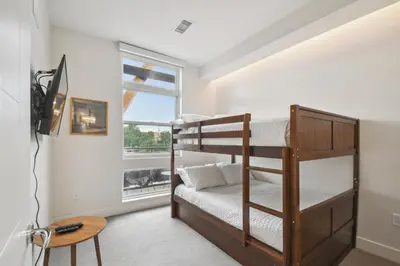 a bedroom with two bunk beds and a window at Sleek & Chic Comforts at Espadin in Denver