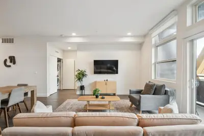 a living room with a couch and a table at Sleek & Chic Comforts at Espadin in Denver