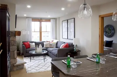 a living room with a couch and a table at Luxury 2 bed 2 bath Condo in River Run with Pool and Hot Tub in Keystone
