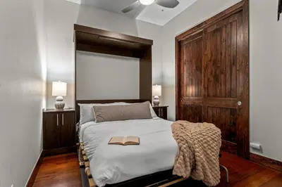 a bedroom with a bed with a book on it at Chic Loft Heart of RiNo in Denver