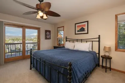 a bedroom with a bed and a ceiling fan at Stunning Mountain Retreat with View and Private Hot Tub in Tabernash
