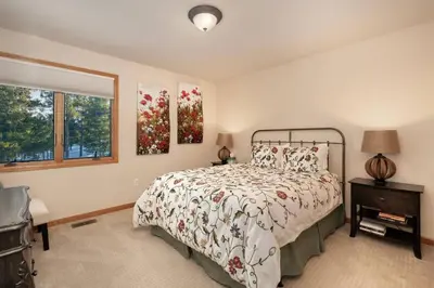 a bedroom with a bed and a window at Stunning Mountain Retreat with View and Private Hot Tub in Tabernash