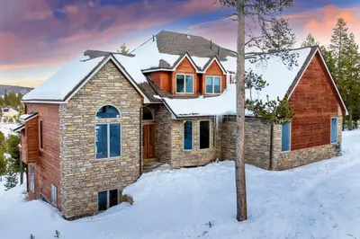 a home with snow on the ground at Stunning Mountain Retreat with View and Private Hot Tub in Tabernash