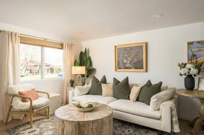 a living room with a couch and a table at The Wild Rose Gatehouse in Arvada
