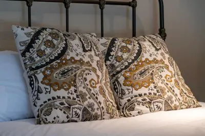 a bed with two pillows on top of it at Wagon Ranch Ultimate Retreat with Hot Tub in Tabernash