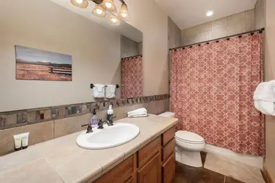 a bathroom with a sink and a toilet at Wagon Ranch Ultimate Retreat with Hot Tub in Tabernash