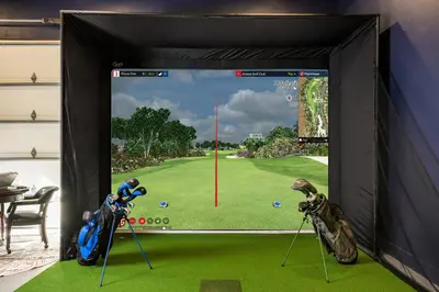 a large screen with a golf game in a room at The Ultimate Hangout House in Denver