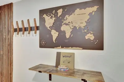 a map of the world hanging on a wall at Brand New Arvada Guest Suite Sauna Fire Pit in Arvada