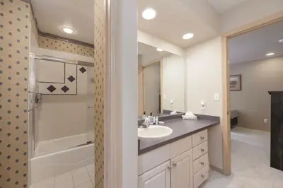a bathroom with a sink and a shower and a tub at Trailside Mountain Retreat with Private Hot Tub in Winter Park