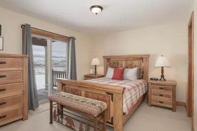a bedroom with a bed and a dresser and a window at Luxe MTN Escape 15 min to Winter Park Base in Tabernash