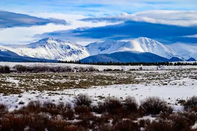a snowy mountain range with snow covered mountains at Luxe MTN Escape 15 min to Winter Park Base in Tabernash