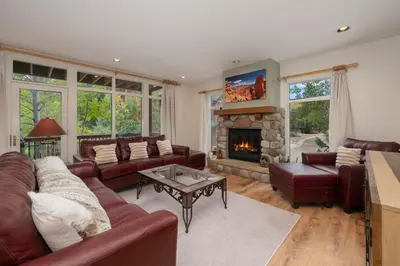a living room with leather furniture and a fireplace at Luxe Home Minutes To Skiing Hot Tub in Winter Park