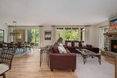 a living room with a couch and a fireplace at Luxe Home Minutes To Skiing Hot Tub in Winter Park