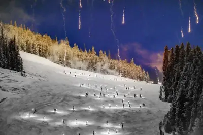 a group of people skiing down a snow covered slope at Luxe Home Minutes To Skiing Hot Tub in Winter Park