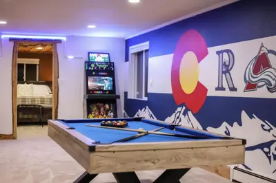a pool table in a room with a wall at Mountain Mansion with Hot Tub and Sauna in Morrison