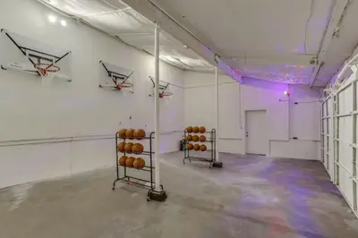 a room with a basketball hoop and basketball racks in it at Mountain Mansion with Hot Tub and Sauna in Morrison