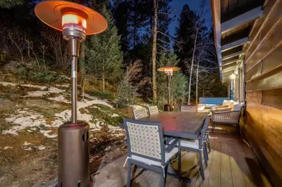 a patio with a table and a street light at Mountain Mansion with Hot Tub and Sauna in Morrison