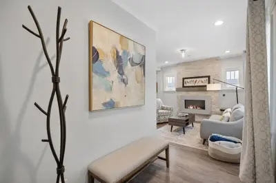 a living room with a couch and a fireplace at DU Cherry Creek Bungalow Sleeps 4 in Denver